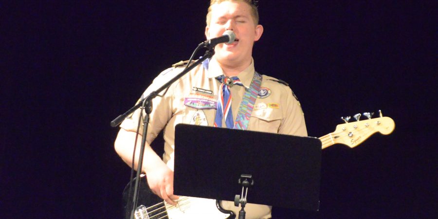 Eagle Scout Thomas Larsen sings on Scout Sunday.