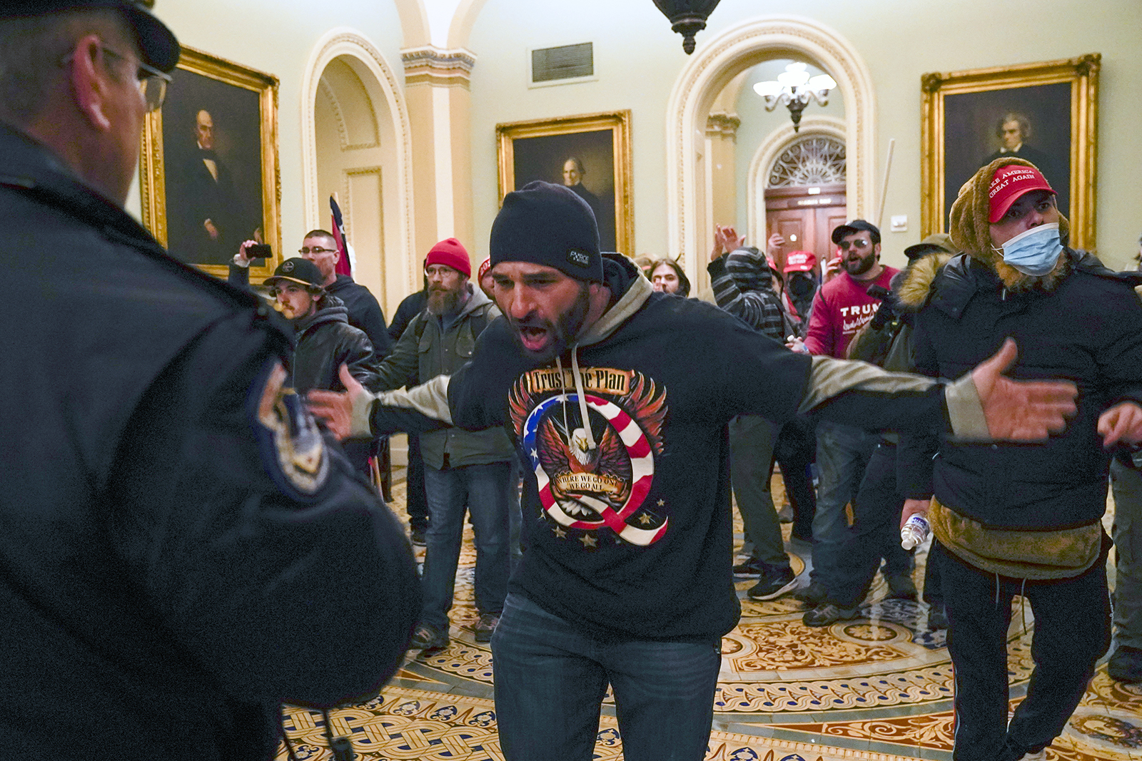 Insurrectionists gather inside the Capitol hallways.
